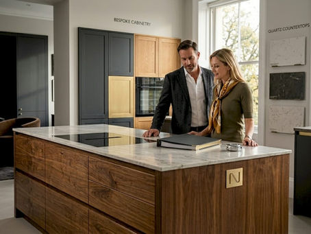 Couple viewing high-end kitchen showroom display