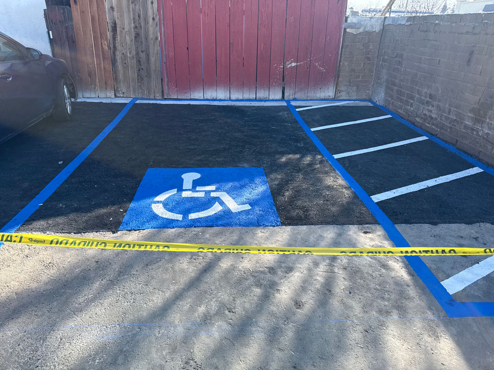 Handicap parking space with blue lines and symbol.