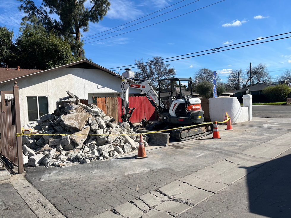 Construction site with rubble and machinery.