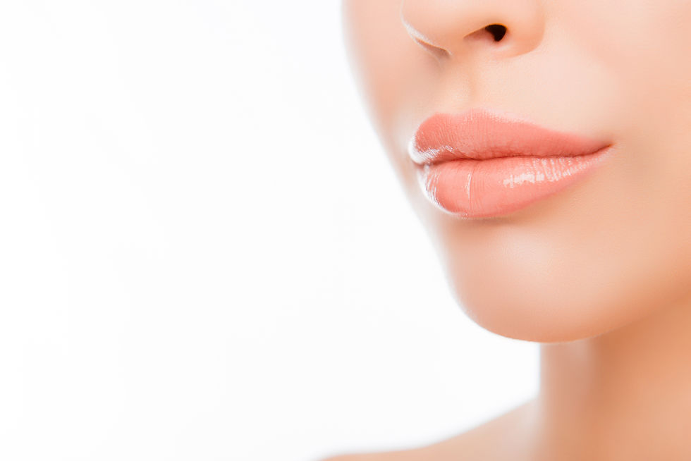 Close up photo of woman's lips with natural make up on white background.jpg