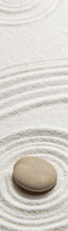 Sand mit rundem Stein