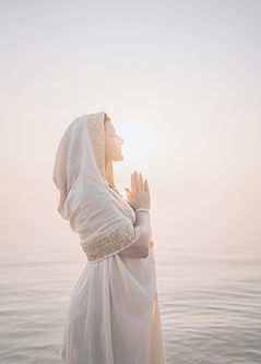 a woman in a white dress standing in the
