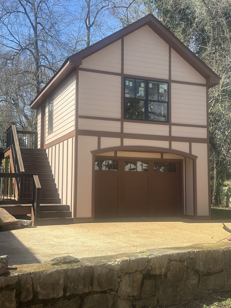 Front elevation of an Atlanta ADU built from the ground up, with a garage door and upper-story window.