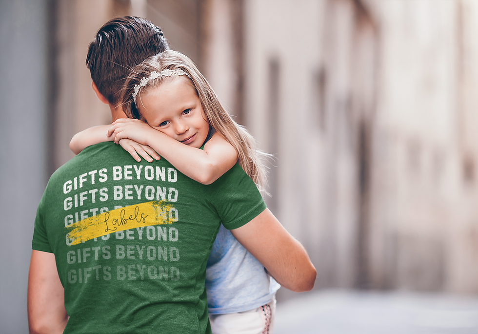 Thumbnail: Green Affirmation Tee worn by adult male hugging his daughter