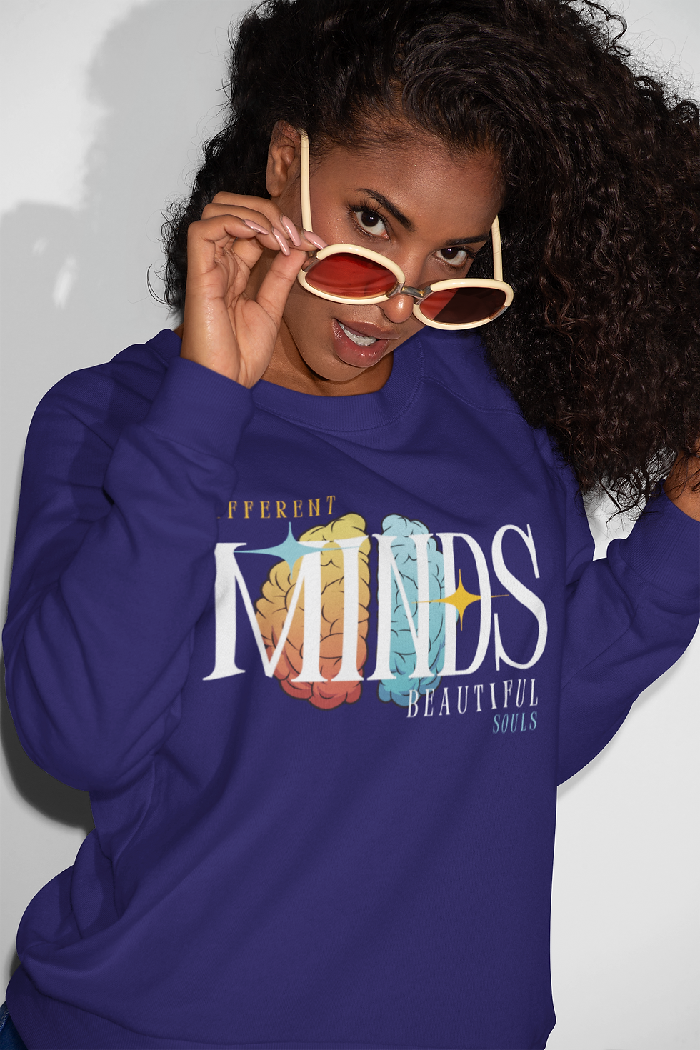 Thumbnail: Purple Beautiful Minds Sweatshirt features a bold brain design woven into the word ‘Minds