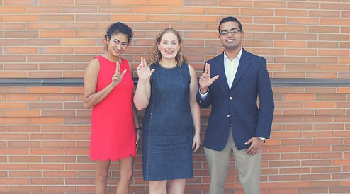Members of SGA Judicial Branch holding their hands up to form the letter "L"
