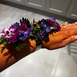 Ladies arm with a fresh flower corsage