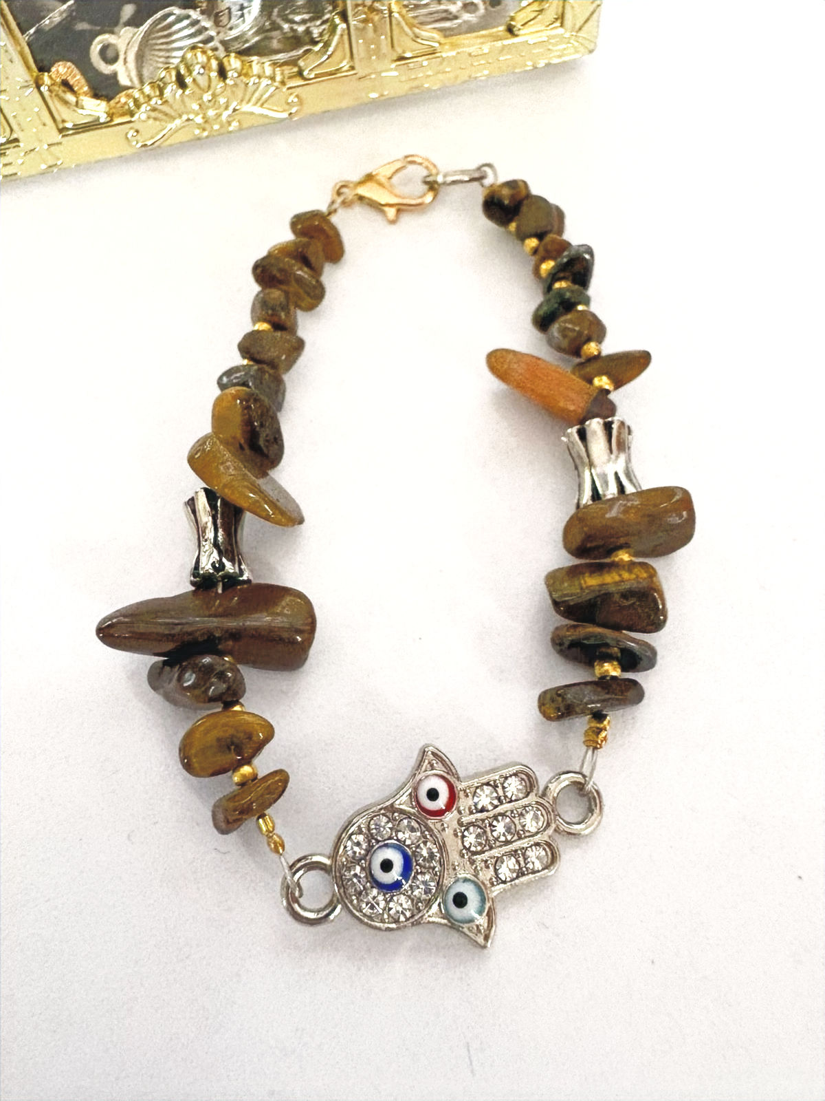 Pulsera artesanal con Ojo Turco, Mano de Fátima y Ojo de Tigre