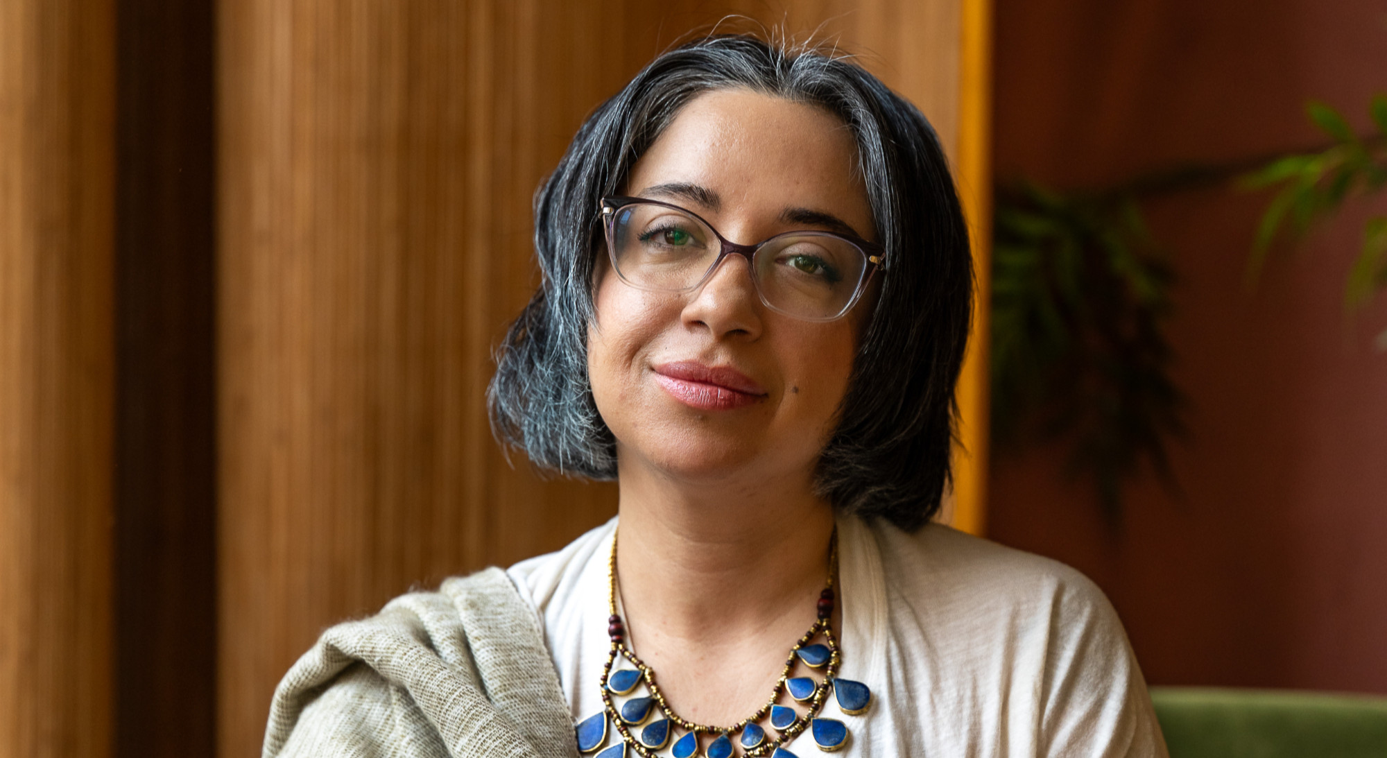 Miriam Siddiq, South Asian therapist, in a warm headshot against a neutral background, symbolizing South Asian therapy in NYC | immigrant therapy nyc - immigrant grief therapy nyc - south asian therapist nyc