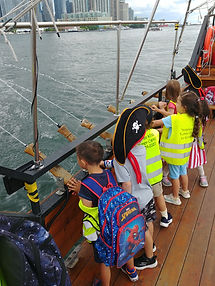sailing on a pirate cruise during summer camp