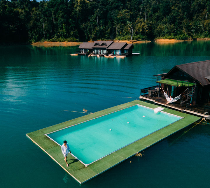 Enjoy a refreshing swim in a unique floating pool surrounded by the emerald waters and natural scenery of the lake.