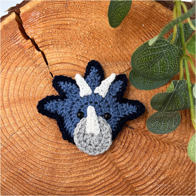 Thumbnail: Dinosaur double pompom hat