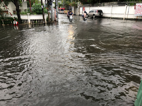 Walking home on a rainy day in Thao Dien