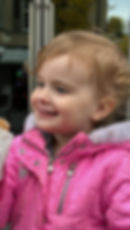 Cute toddler with ice cream on her face