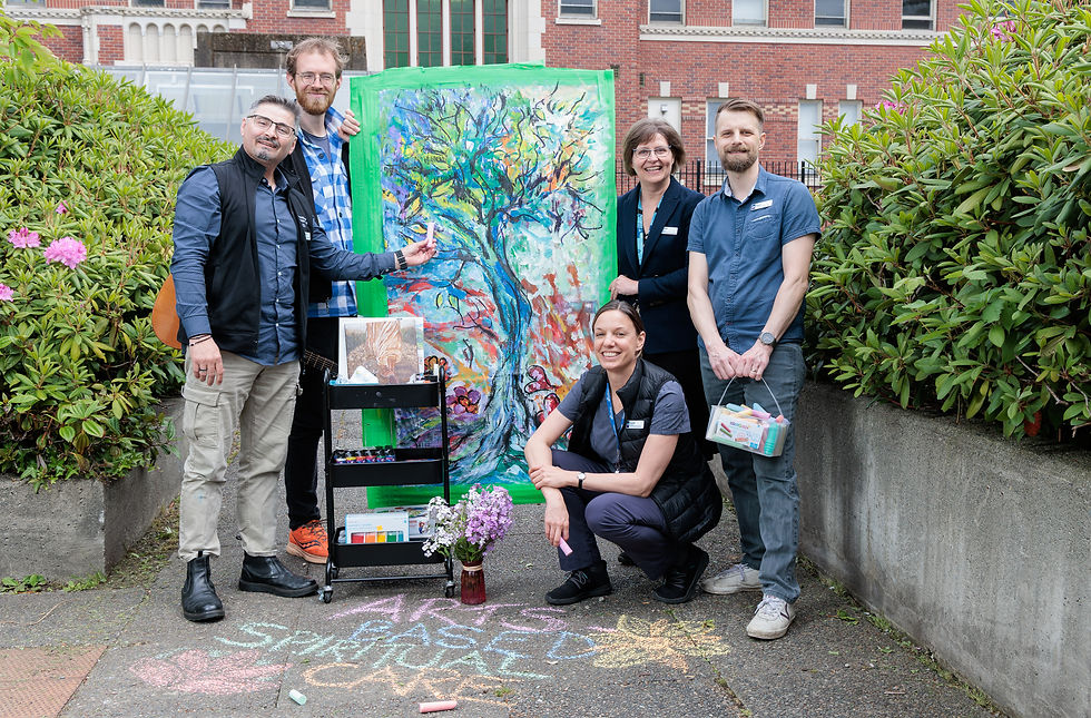 Some of the Providence Health Care Spiritual Health Care Team with an Art Cart. Left to Right: Nicu Liuta, Jack Thomson, Rachel Jones (kneeling), Anne Tuppurainen, Ryan Giesbrecht.