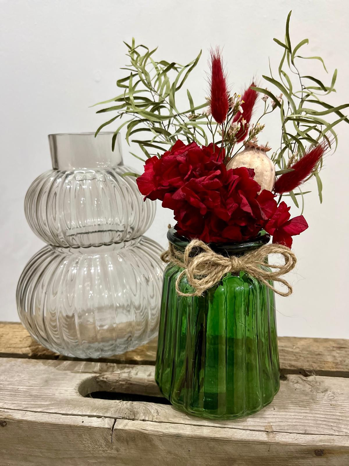 Green glass vase with florals