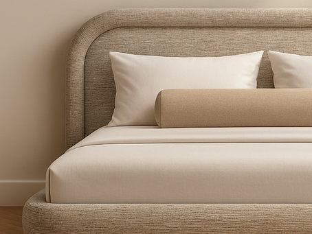 bed with curved headboard, round legs and cylinder cushion from the Sculpted Abode.