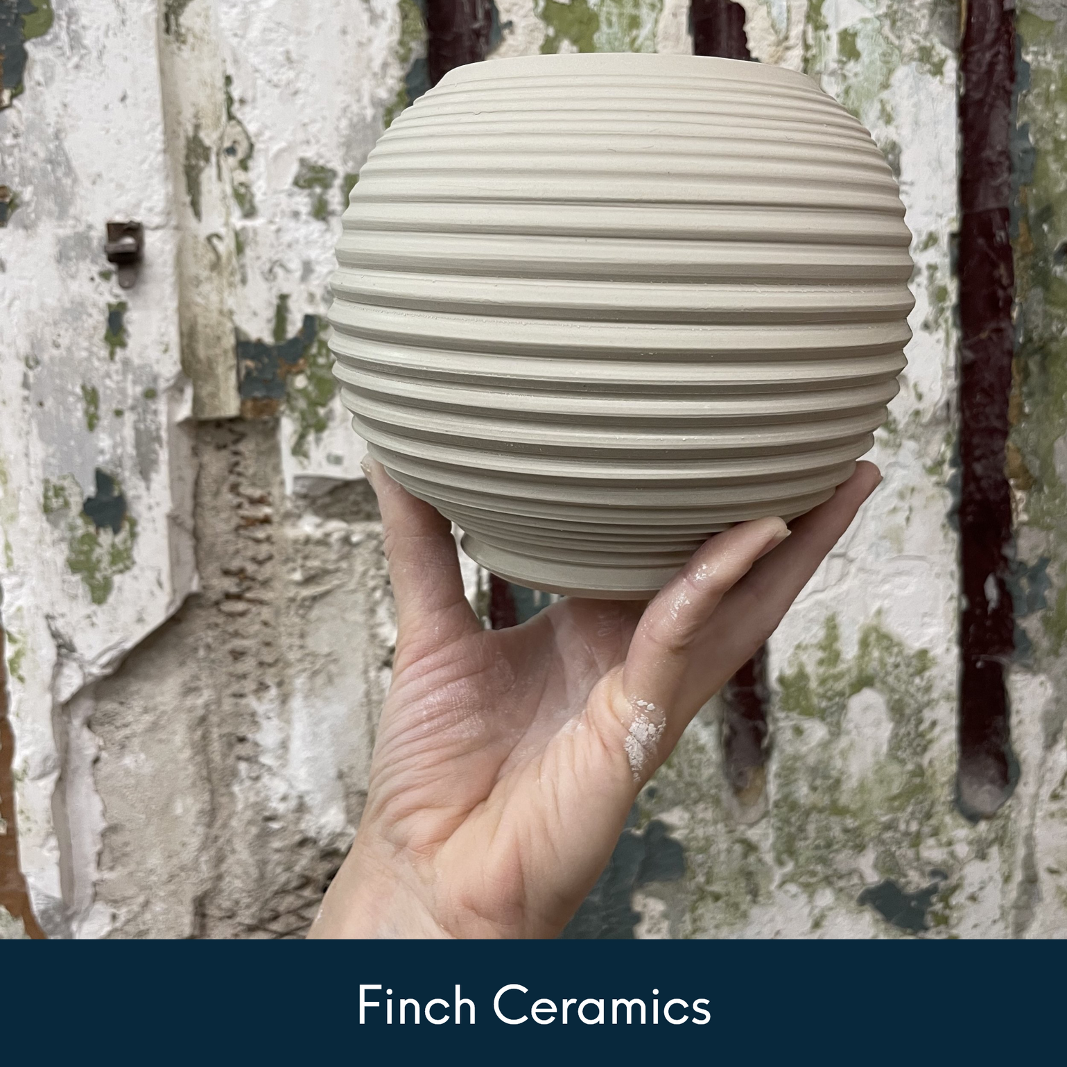 Finch Ceramics - Jessica holding a ceramic vessel