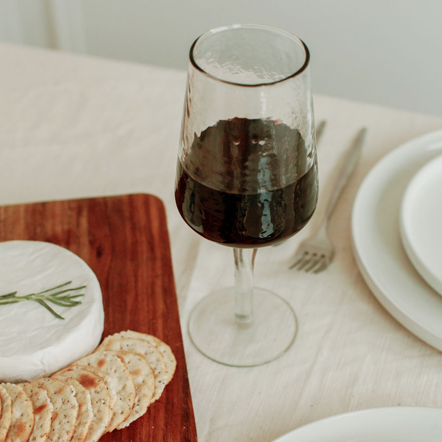 Thumbnail: Set of 2 Handblown Hammered Wine Glasses on table with crackers and cheese