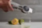 Aluminum Hand Juicer squeezing juice