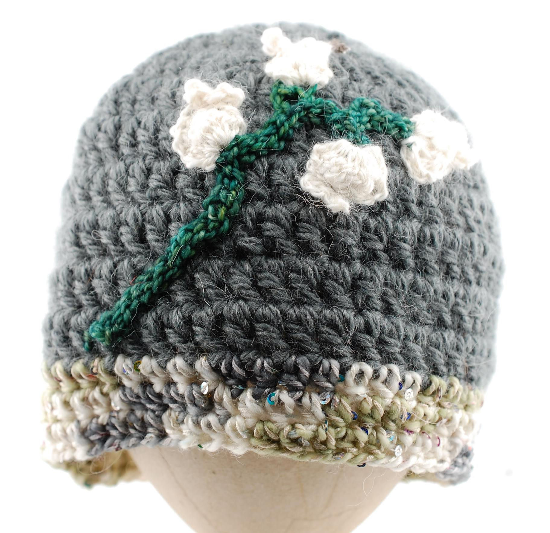 Grey Crocheted Cloche Style with White Flowers and Green Stem