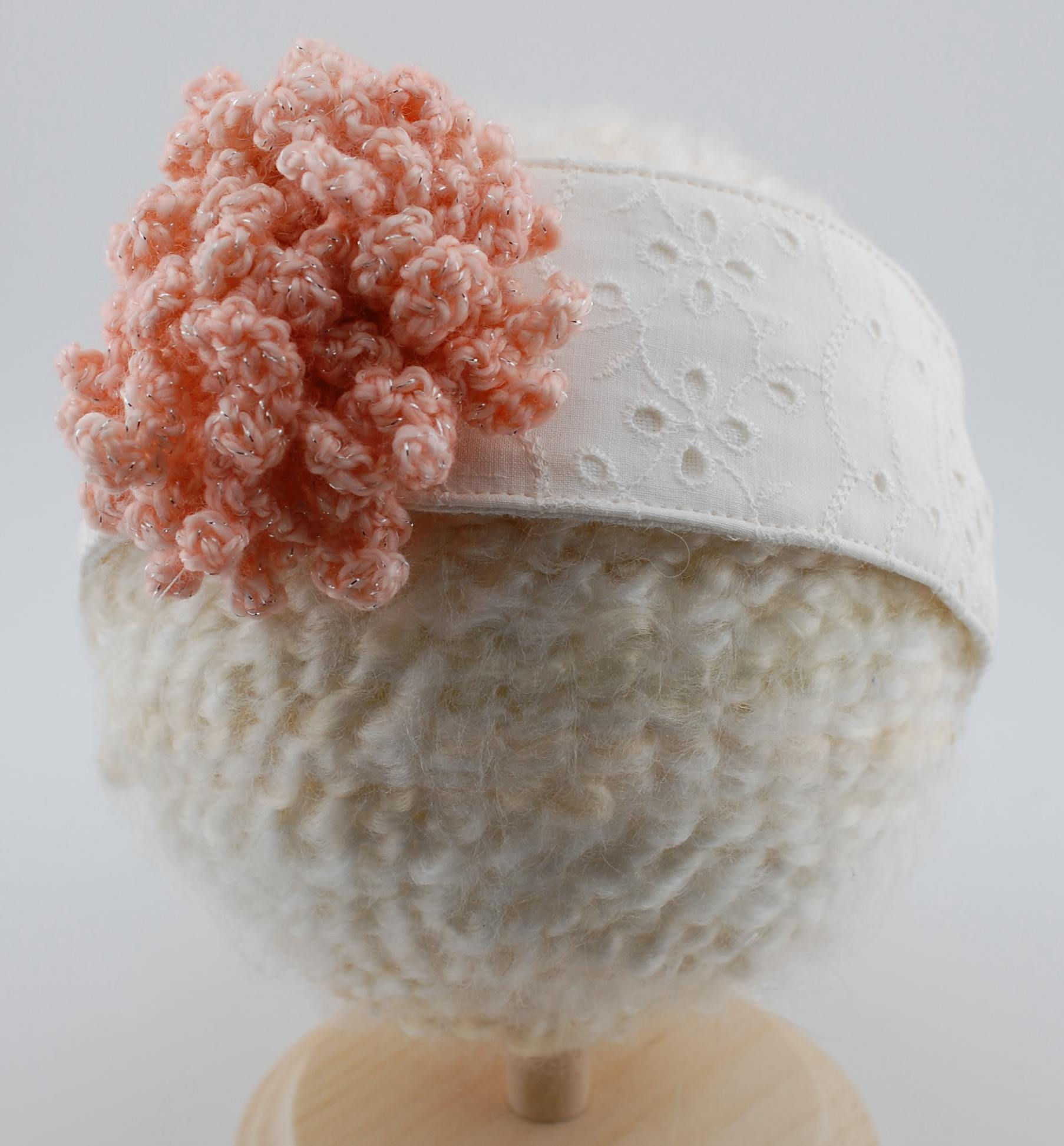 White Floral Embossed Vintage Fabric Headband with Peach Glitter Crochet Flower