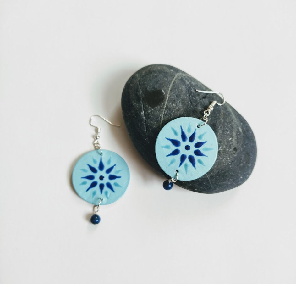 Thumbnail: Circle earrings with light blue background, flower decoration in cobalt and teal glaze, lapiz lazuli sphere bead