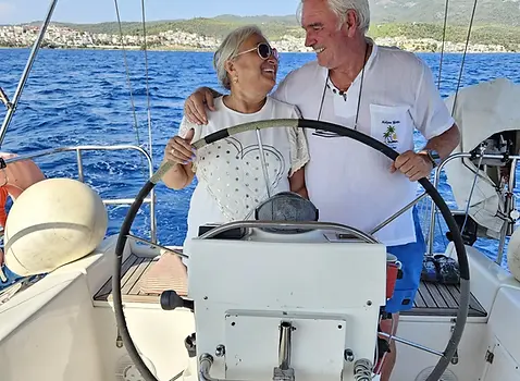 Couple relaxing on sailing boat in Sithonia