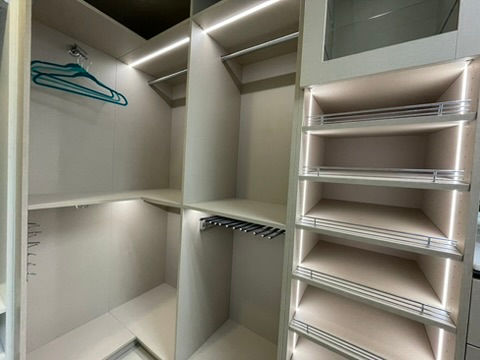 High-end custom walk-in closet with elegant cabinetry, premium finishes, and organized storage, designed by Greatstone Design for a luxury Miami home.