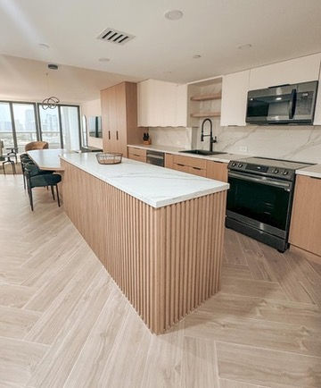 Modern kitchen remodel with sleek cabinetry and premium finishes, designed and executed by Greatstone Design in Miami.