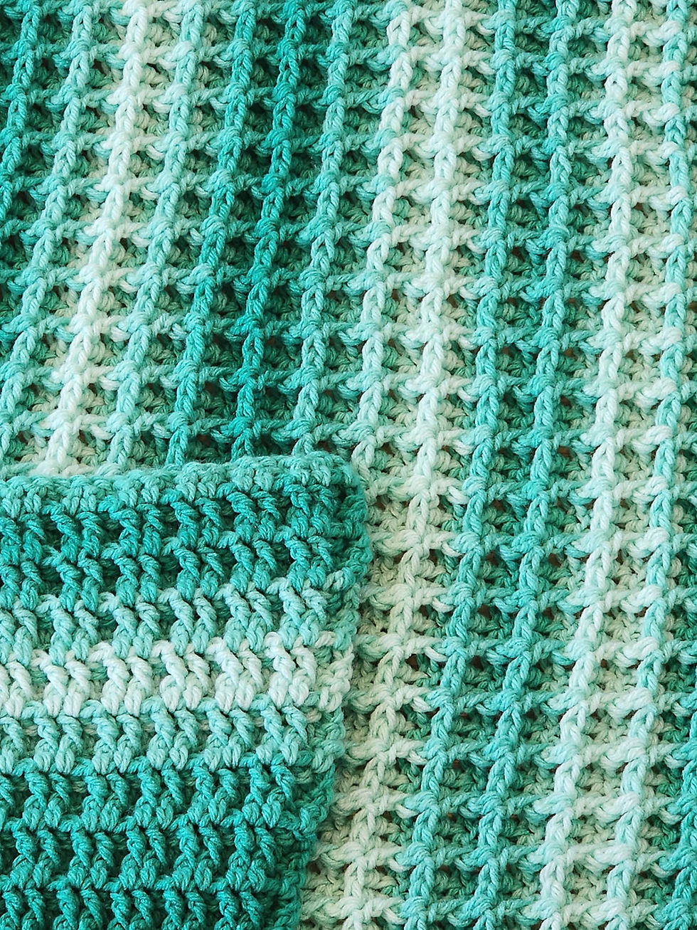 Waffle Stitch throw in ombre green.