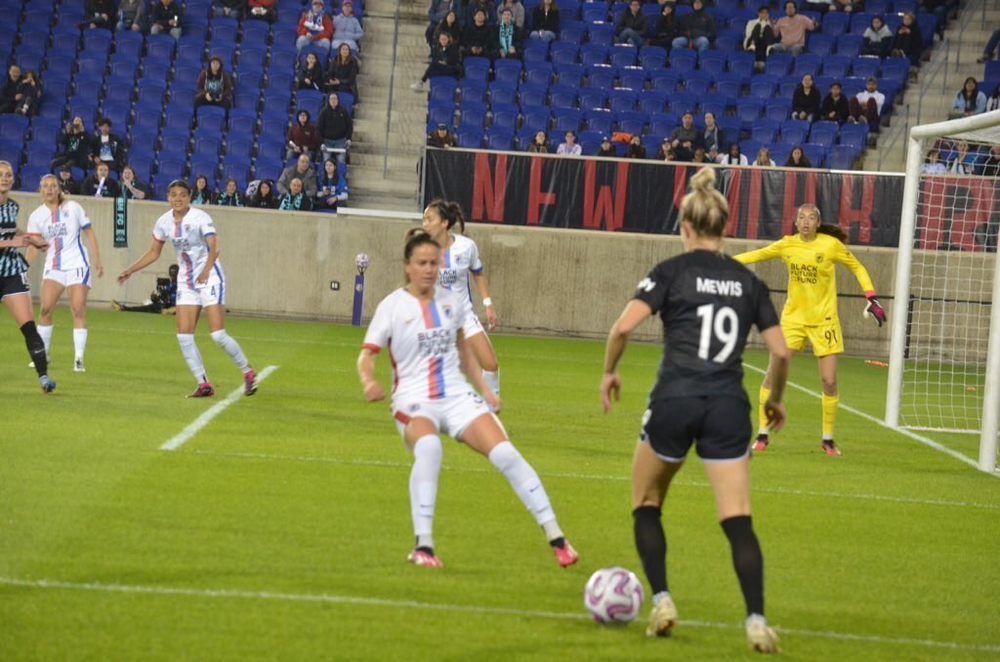 K Mewis trying to get in on goal with Phallon Tullis-Joyce K Mewis trying to get in on goal with Phallon Tullis-Joyce