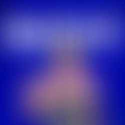 Ben, a Singaporean investor, in a striped shirt, points up against a blue background. Bold text reads "VOLATILITY IS NOT RISK."