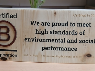 A plaque of Wavehill's B Corp Certification