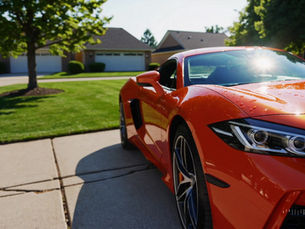 orange sports car in wisconsin after a 360 detailing service.