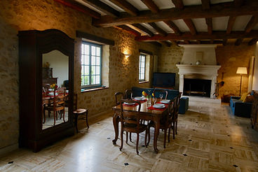 Main living/dining room and large stone fireplace