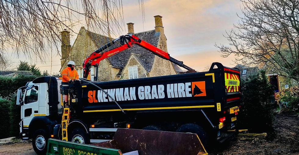 High angle view of a grab lorry unloading soil at a construction site