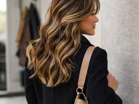 Woman leaving home with soft balayage hair color, showing natural dimension and low-maintenance grow-out in natural light