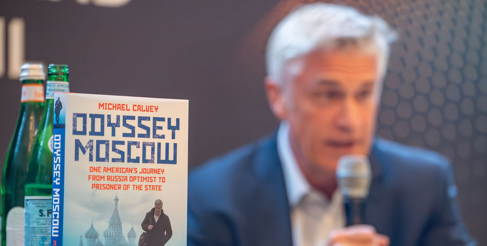 Odyssey Moscow Book with Author Michael Calvey Speaking in the background of the FT Live Berlin Edition 2025