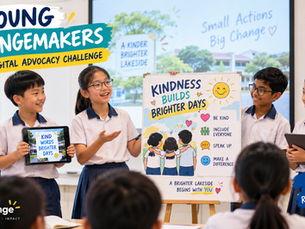 Students present kindness posters in classroom; signs read Young Changemakers, Kindness Builds Brighter Days, Student Voices Real Change.