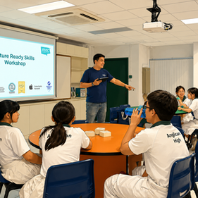 Presenter leads Future Ready Skills Workshop to Anglican High students in a classroom, with slide and smiling learners at tables