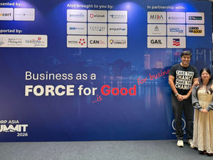 Three people smile at a B Corp Asia Summit 2026 backdrop reading Business as a Force for Good with sponsor logos.