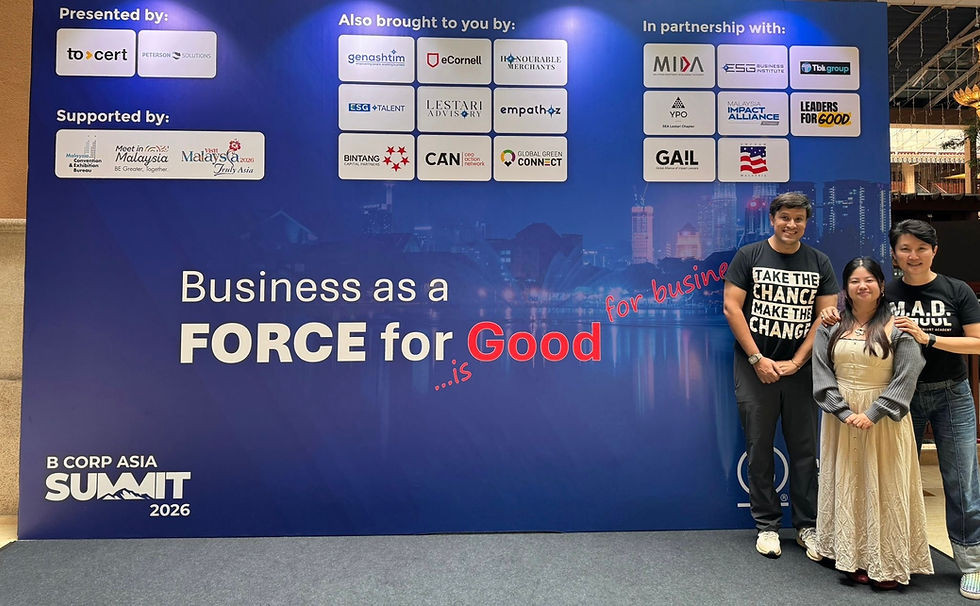 Three people smile at a B Corp Asia Summit 2026 backdrop reading Business as a Force for Good with sponsor logos.