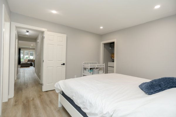 Renovated primary bedroom after making the long room more functional