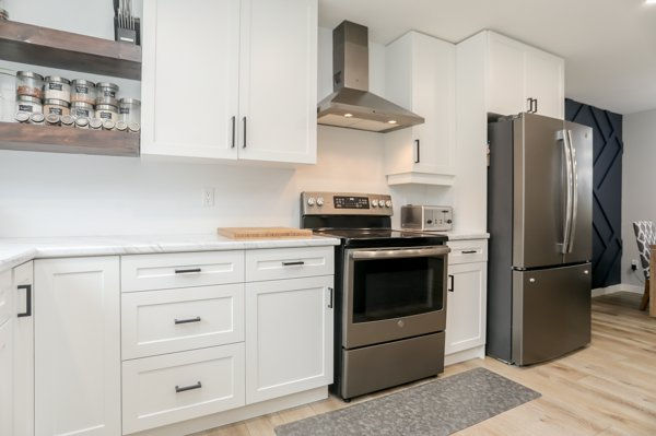 Finished kitchen renovation with updated cabinets, island and lighting