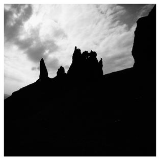 Light trying to infiltrate and illuminate the dark land.
Silhouettes of rock formation Old Man of Storr, Isle of Skye, Scotland.
Minimal, high contrast, black and white landscape digital image.

© 2014 George Vlachos