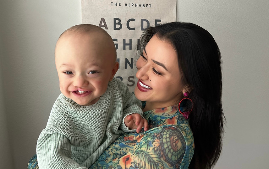 photo of smiling baby with mother