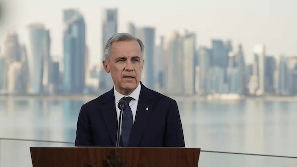 Prime Minister Mark Carney delivers remarks during a recent visit to Qatar.