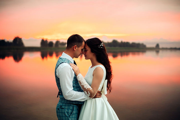 waist-up-romantic-wedding-couple-hugging-posing-by-lake-sunset-with-amazing-view-wedding-c