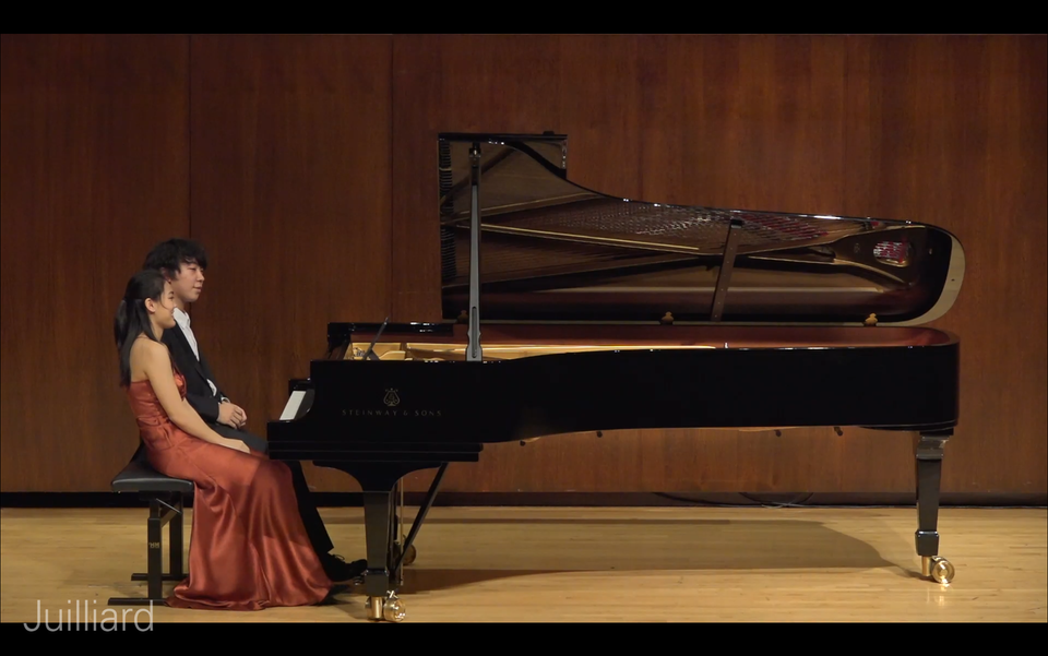 Jiahao Han performing with Vicky Lam in Paul Hall of Juilliard